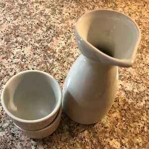 White ceramic saki pitcher and cups